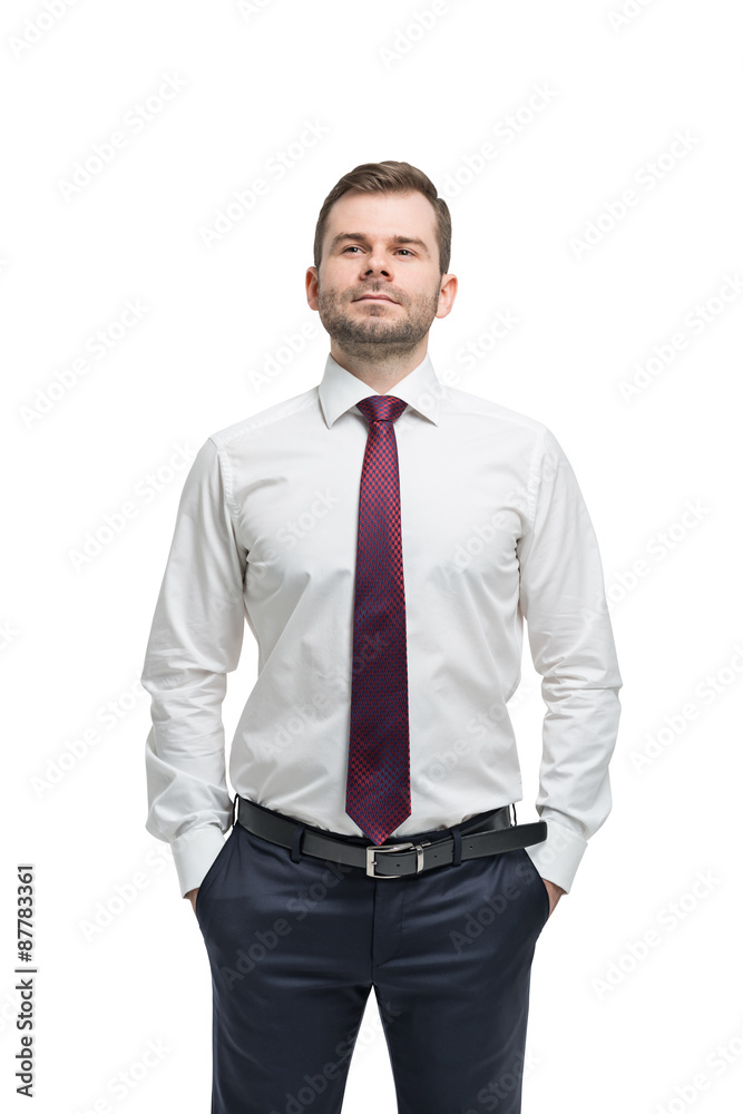 Confident businessman with hands in pockets. Isolated on white background. Confident businessman with hands in pockets. Isolated on white background.