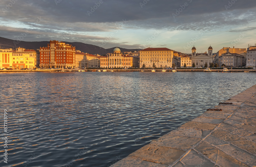 Seafront of Trieste with beautiful palaces and church, Italy