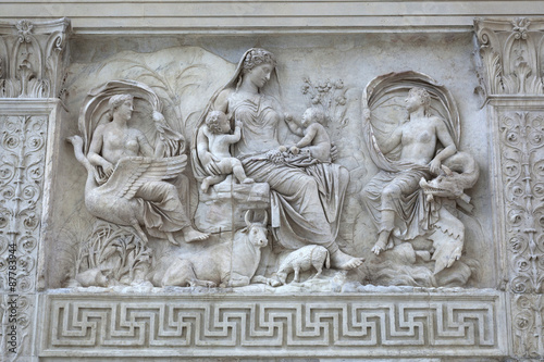 Relief of female Goddess with Twins on the Ara Pacis (Altar of Augustan Peace) in Rome, Italy photo