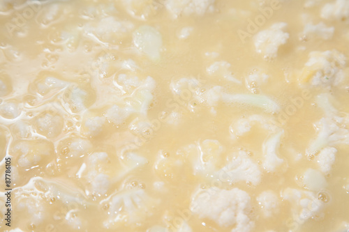 Closeup of cut cauliflower in stainless steel bowl