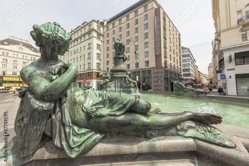 Women statue at Donnerbrunnen (fountain) in Vienna, Austria photo