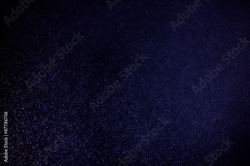abstract dark bokhe lights background , purple,black and subtle gold. defocused background