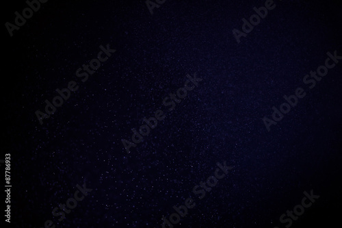 abstract dark bokhe lights background , purple,black and subtle gold. defocused background