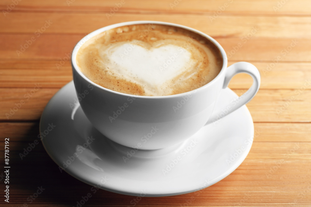 Cup of coffee latte art on wooden background Cup of coffee latte art on wooden background