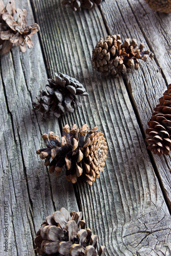  Pine cones on wooden background