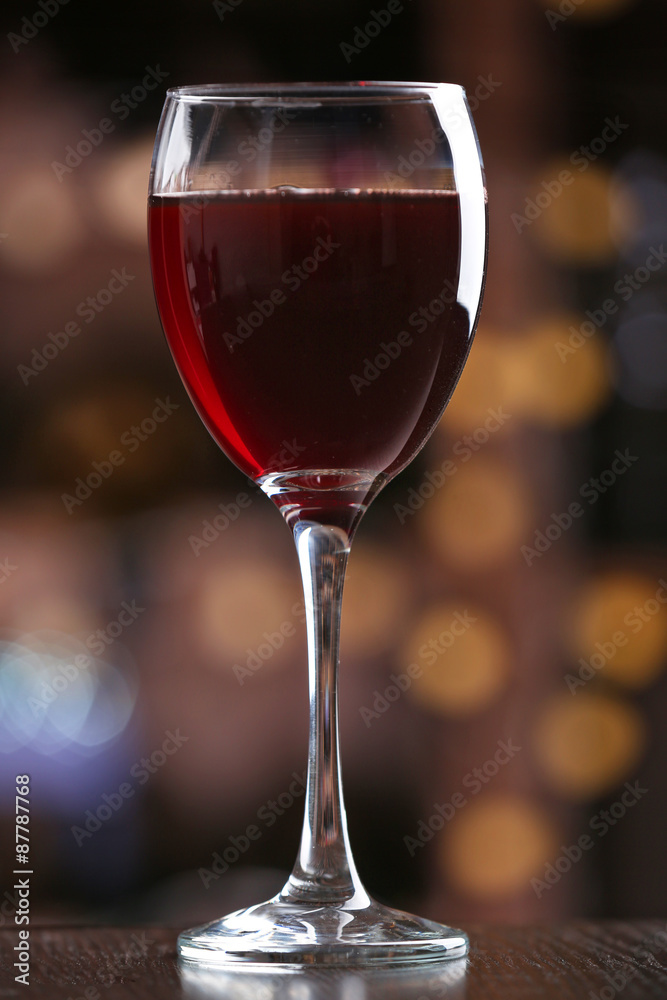 Glass of red wine on bar background Glass of red wine on bar background
