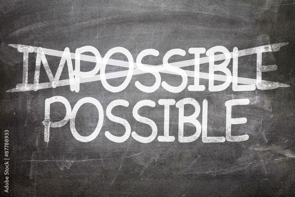 Fototapeta premium Impossible Possible written on a chalkboard