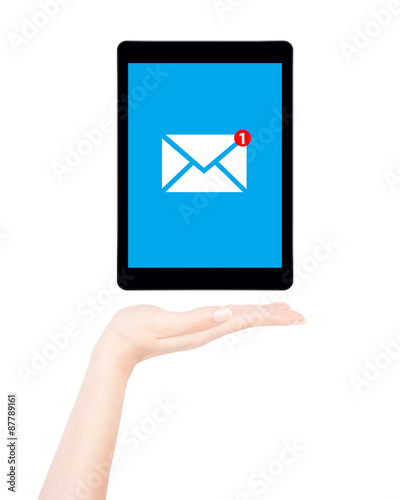 Female hand shows tablet computer with message notification