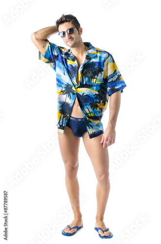 Handsome, athletic young man with open shirt and swimming suit