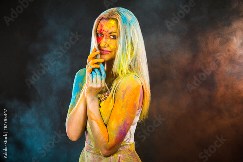 Beautiful young woman covered with colored powder © art_zzz