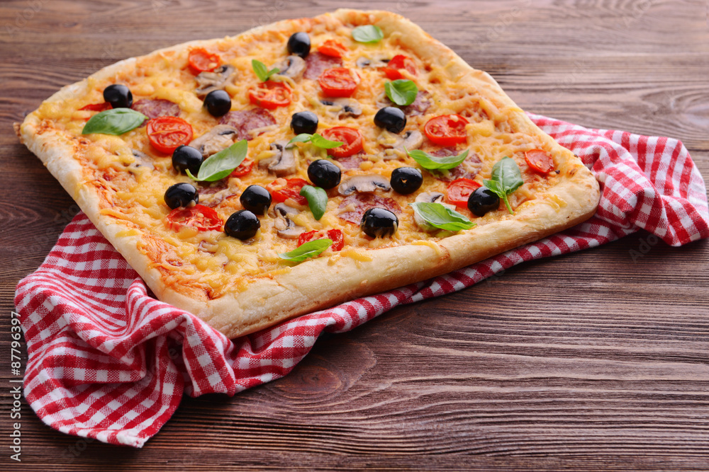 Delicious homemade pizza on table close-up Delicious homemade pizza on table close-up