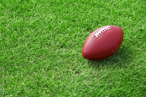 Rugby ball on green field
