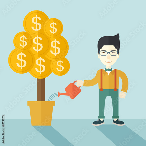 Asian businessman happily watering the money tree.