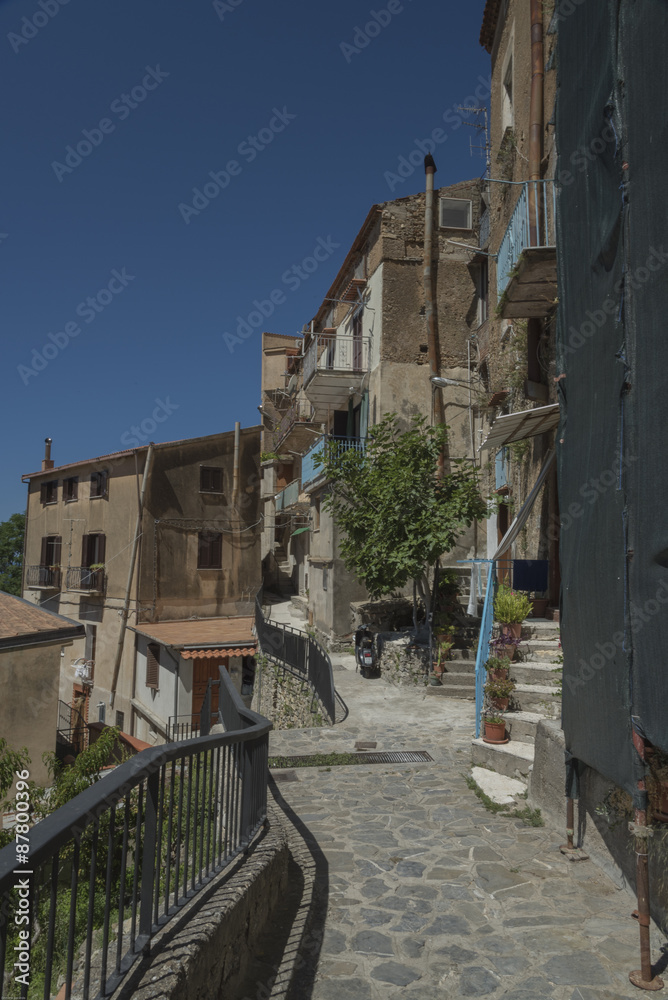 Pisciotta, Cilento, Italy. Small medieval village. Small squares, streets, stairways, Mediterranean colors, stone, bricks, doors and portals. Sky, sun and sea.