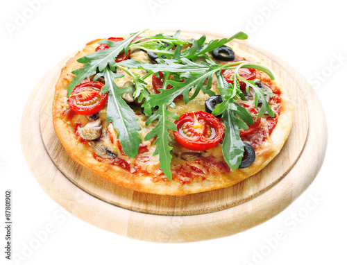 Tasty pizza with vegetables and arugula on cutting board isolated on white