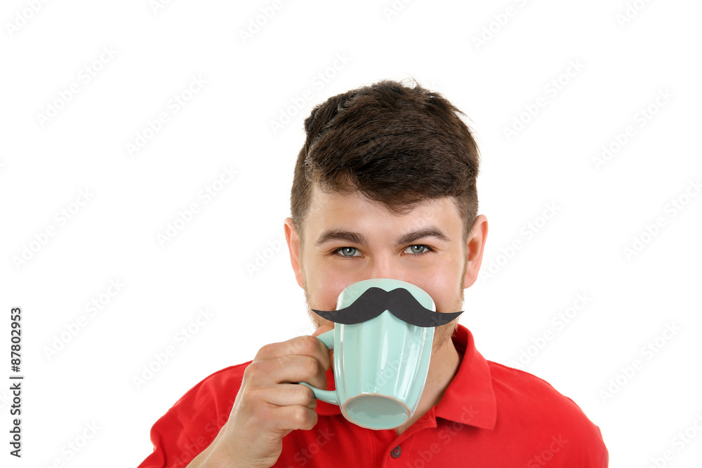Portrait of man drinking from cup with cutout mustache, isolated on white Portrait of man drinking from cup with cutout mustache, isolated on white