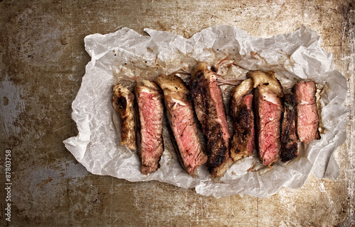 rustic cut juicy barbecue grilled steak photo