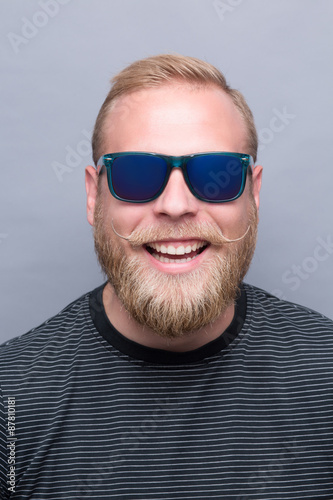 Smiling bearded man in sunglasses