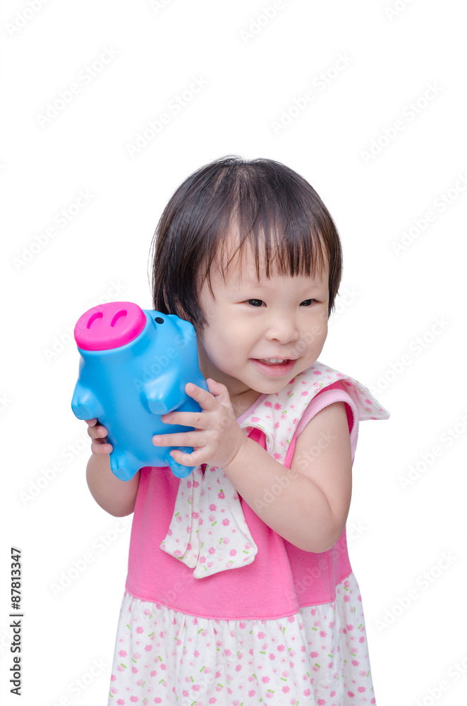 Asian girl smiling with piggy bank over white Asian girl smiling with piggy bank over white