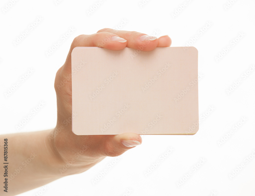 Obraz premium Female hand holding a paper card
