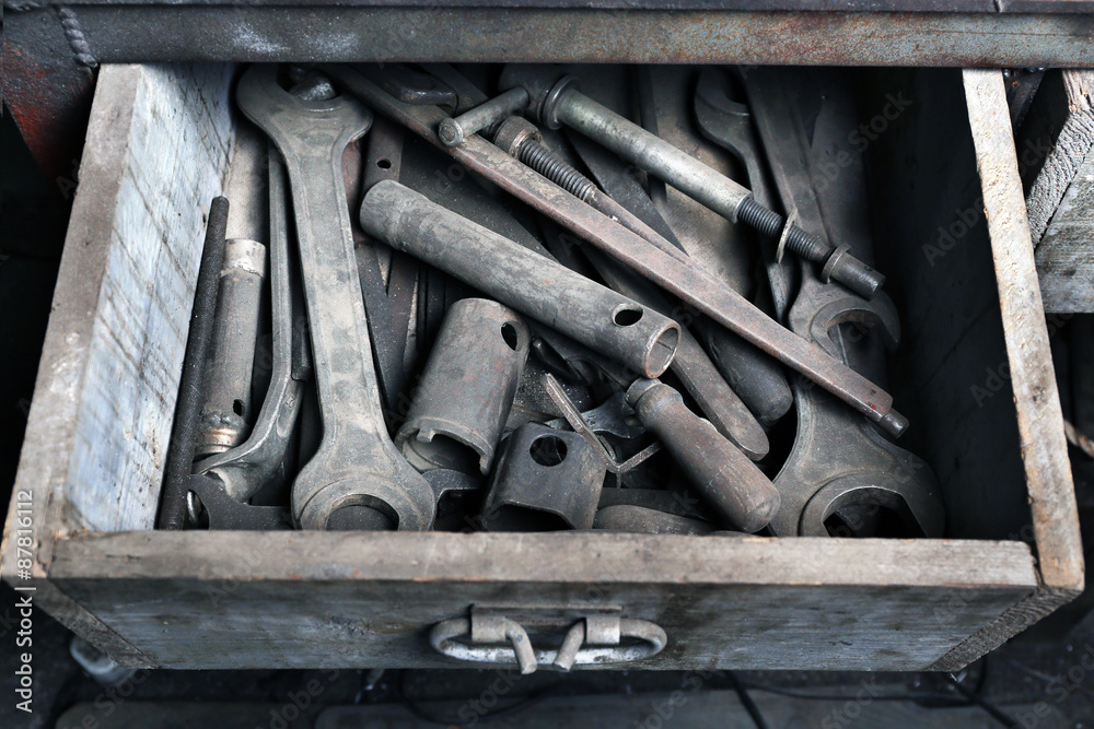 Different tools in box on workplace in garage Different tools in box on workplace in garage