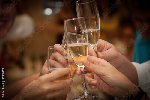 Group of People Enjoying a Celebratory Toast with Champagne Flutes