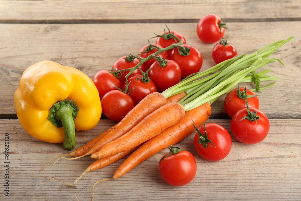 Fresh vegetables on wooden table, closeup Fresh vegetables on wooden table, closeup