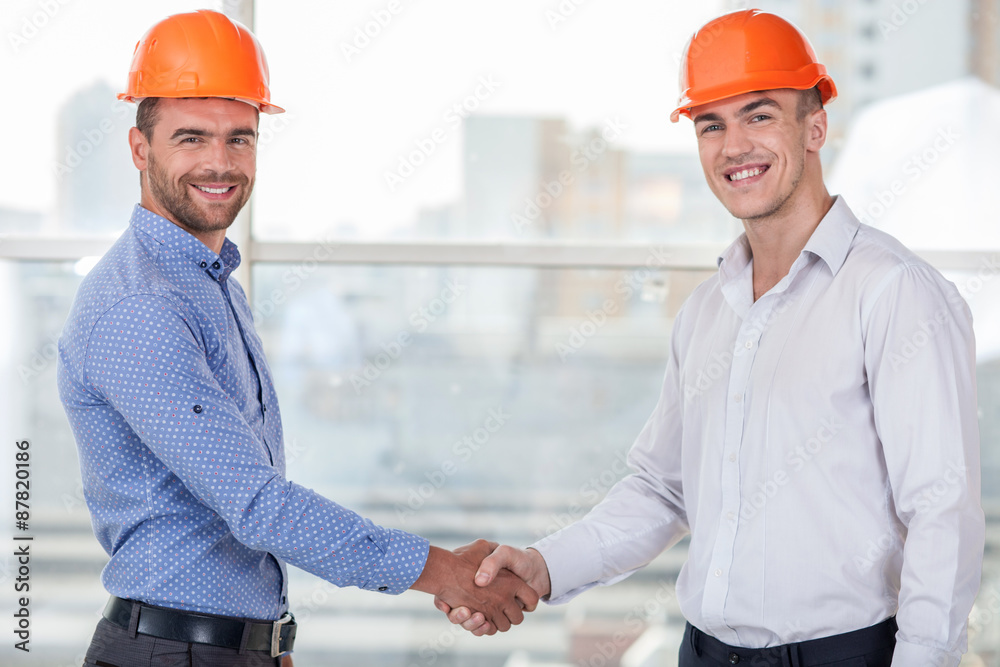 Attractive young workers is congratulating each other Attractive young workers is congratulating each other