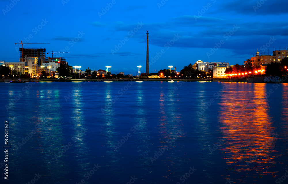 Night view of evening city with the river Ural Ekaterinburg