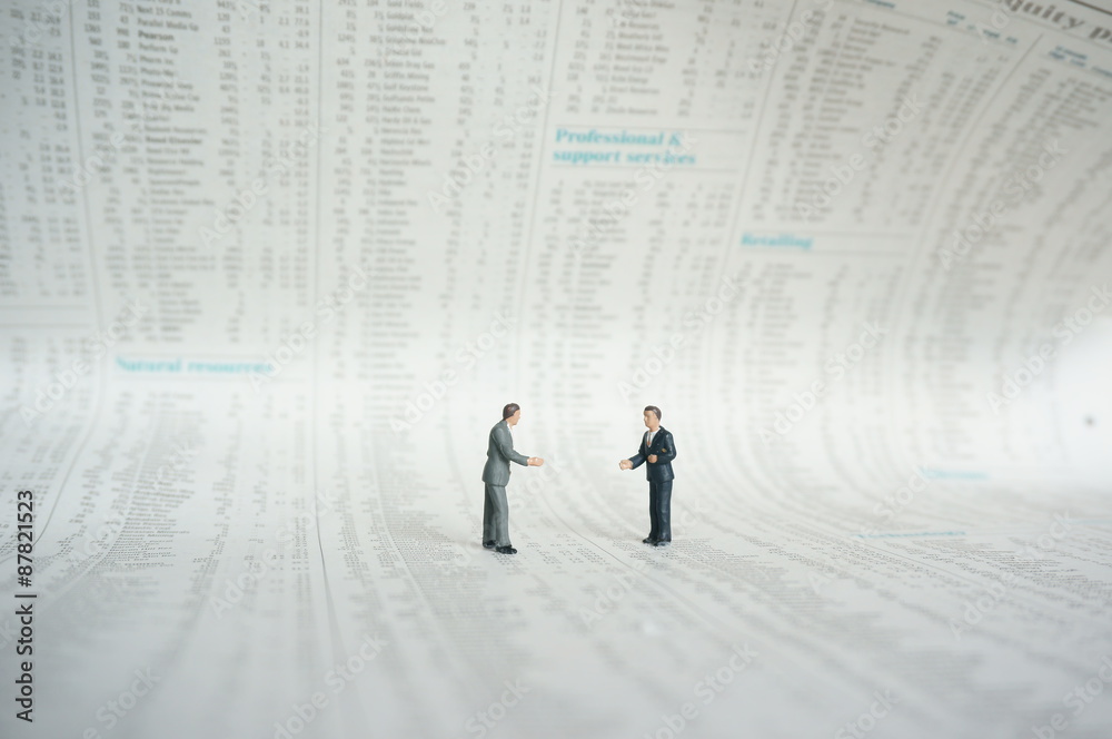 Miniature business figures newspaper.
Miniature scale model businessmen standing on shares page of a newspaper. Miniature business figures newspaper.
Miniature scale model businessmen standing on shares page of a newspaper.