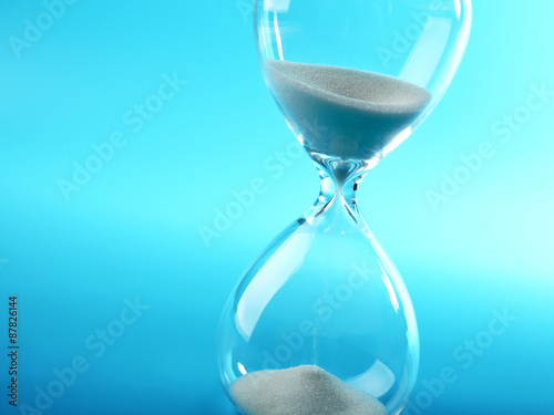 Hourglass on blue background