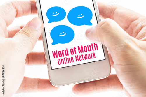 Εκτύπωση καμβά Close up Two hand holding smart phone with word of mouth online