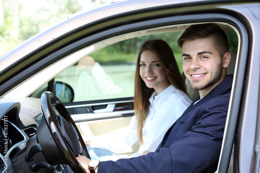 Young couple in cabriolet Young couple in cabriolet