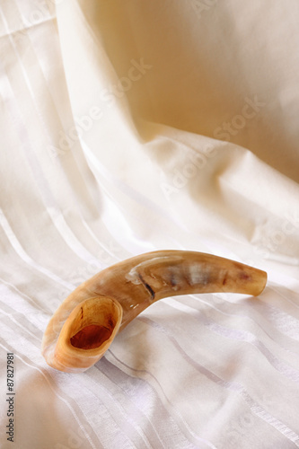 Fototapeta Naklejka Na Ścianę i Meble -  shofar (horn) on white prayer talit. rosh hashanah (jewish holiday)
