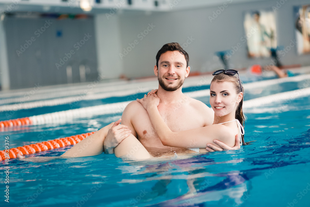 Young couple in the swimming pool Young couple in the swimming pool