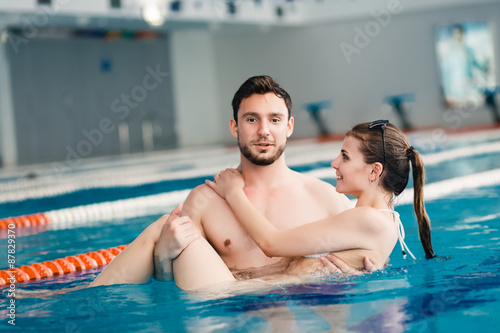 Young couple in the swimming pool