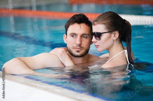 Young couple in the swimming pool © mrcats