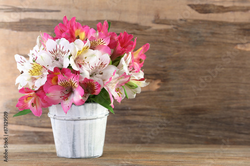 Fototapeta Naklejka Na Ścianę i Meble -  Bouquet of alstroemeria on wooden background
