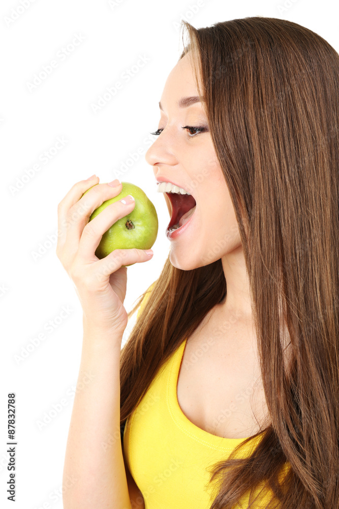 Healthy young woman with green apple isolated on white