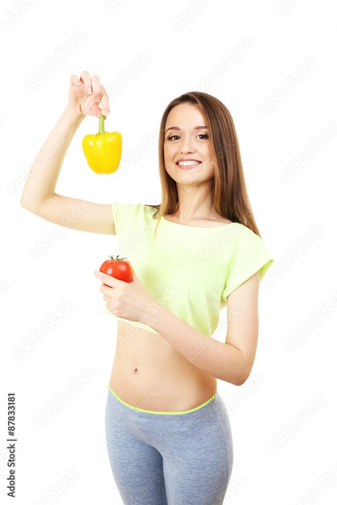 Healthy young woman with pepper and tomato isolated on white Healthy young woman with pepper and tomato isolated on white