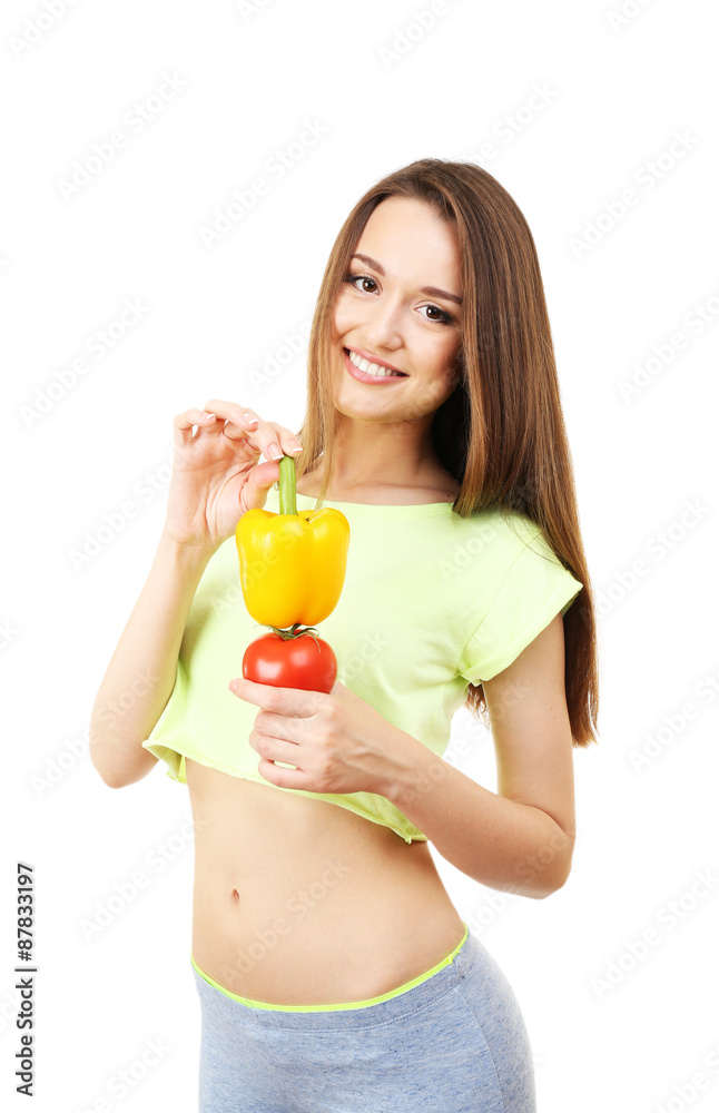 Healthy young woman with pepper and tomato isolated on white Healthy young woman with pepper and tomato isolated on white