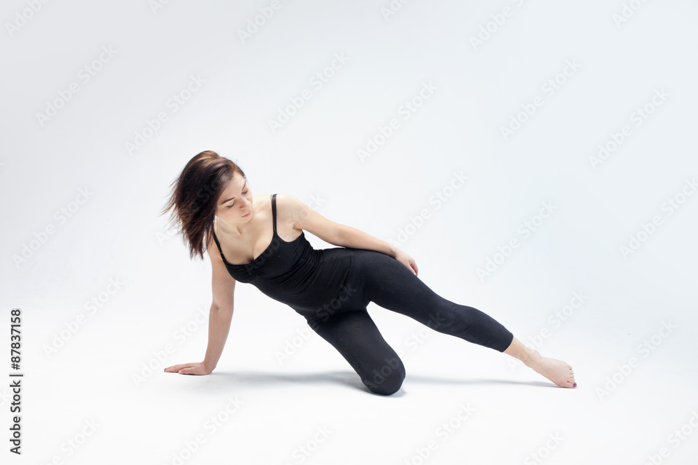 athletic girl posing in Studio, place for your text on the right athletic girl posing in Studio, place for your text on the right