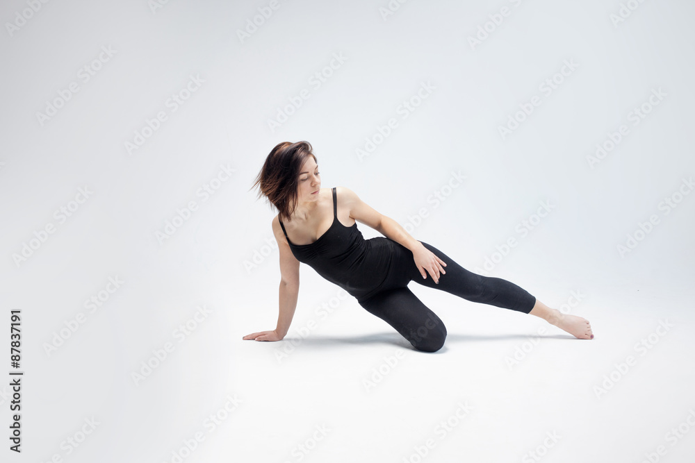 athletic girl posing in Studio, place for your text on the right athletic girl posing in Studio, place for your text on the right