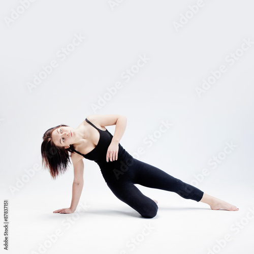 athletic girl posing in Studio, place for your text on the right