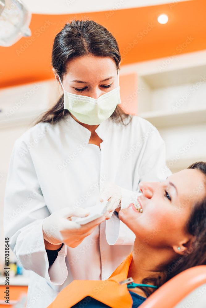 Dentist with female patient