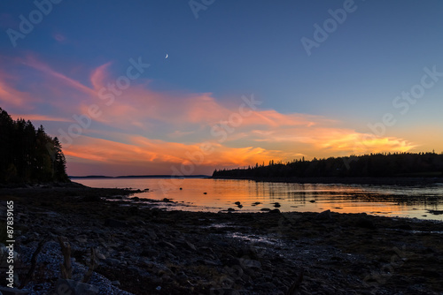 Moon Sunset. Sunset over Atlantic ocean, Maine, USA, with moon rising