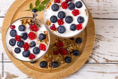 Yogurt, muesli and berries of blueberry and stone bramble