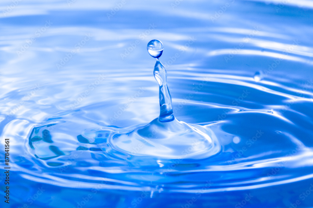 Blue water drop falling down background. Blue water drop falling down background.