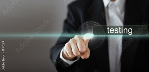 Businessman's hand pressing the icon on virtual screen