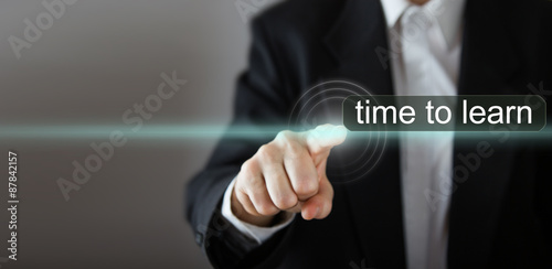 Businessman's hand pressing the icon on virtual screen